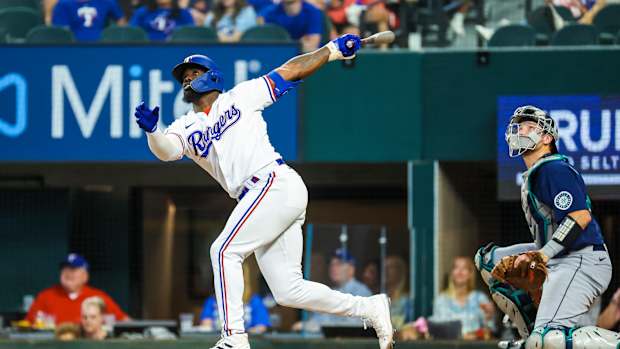 Jun 4, 2022; Arlington, Texas, USA; Texas Rangers right fielder Adolis Garcia (53) hits a three run home run during the fourth inning against the Seattle Mariners at Globe Life Field. Mandatory Credit: Kevin Jairaj-USA TODAY Sports